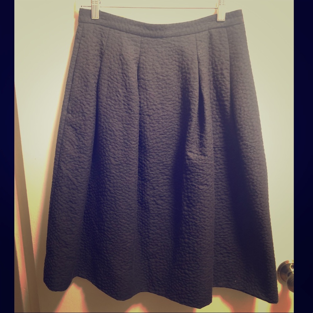 Black textured pleated midi skirt